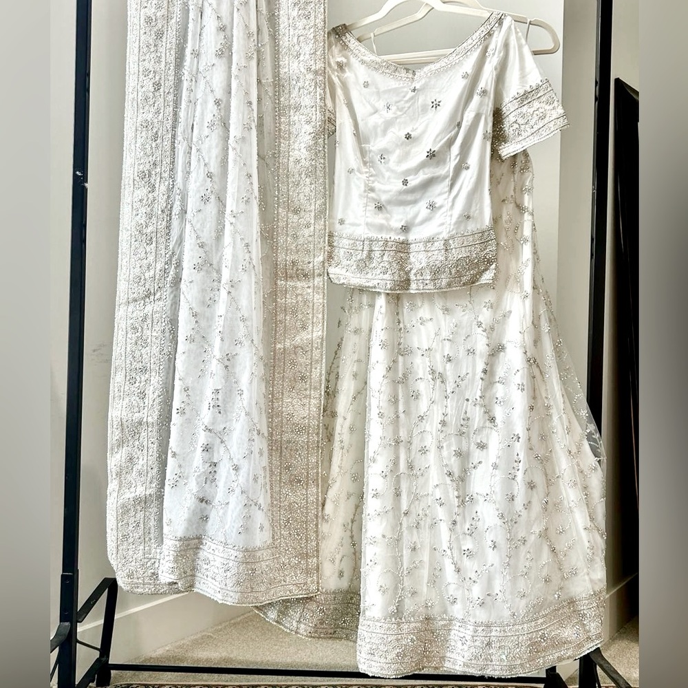 Women’s bridal/engagement/nikkah lehnga in soft white and silver work all over